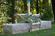 Concrete block with a tool on top in an outdoor setting
