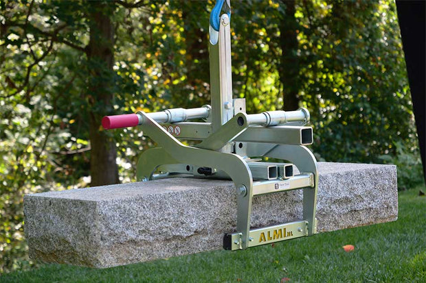 Concrete block with a tool on top in an outdoor setting