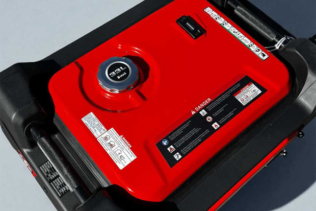 Red and black portable generator with visible branding on a gray background